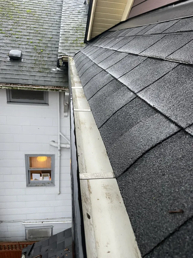 Gutter channel after leaf and debris removal.