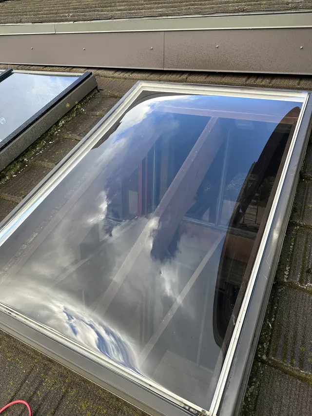 Skylight glass with clearer reflections after cleaning.