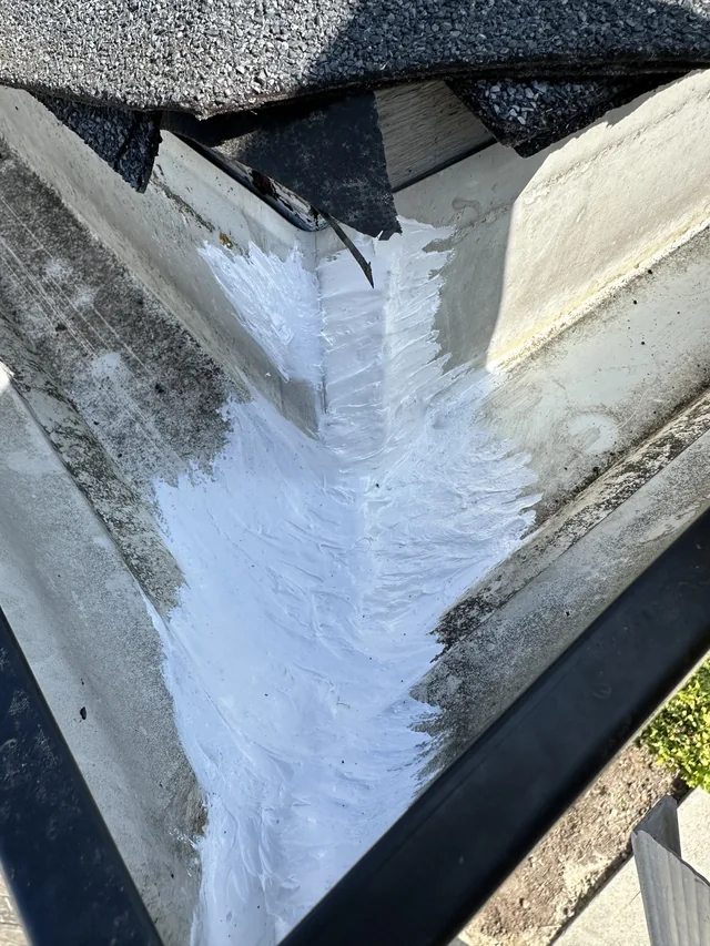 The same second corner after white sealant was applied.